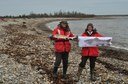 MEFO staff, Wende Mahaney and Fred Seavey, show pride in Maine's anadromous fish while cleaning up Petit Manan Point.