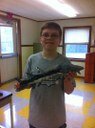 Ryan manages to keep this sturgeon from wiggling while his teacher took their picture! Near the Kennebec, Maine.