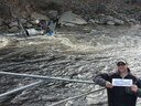 Graham Goulette (NOAA Fisheries) visiting the Sheepscot River while Maine Department of Marine Resources staff tend the Rotary Screw Trap to monitor salmon out migration.