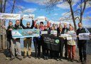 The staff at The Nature Conservancy in Maine proudly display their flat fish alongside the Androscoggin River! 
